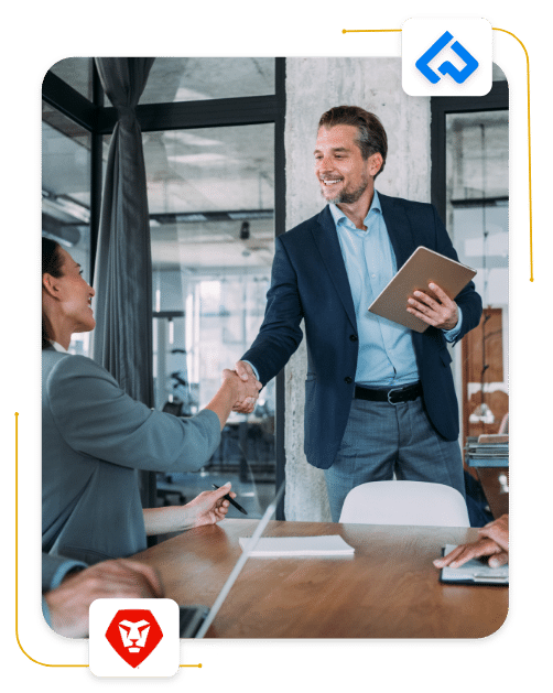 Man and women shaking hands in their office