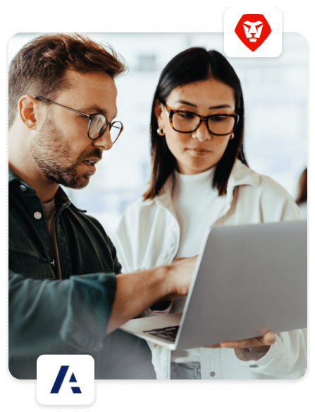 Man gesturing to laptop screen next to woman