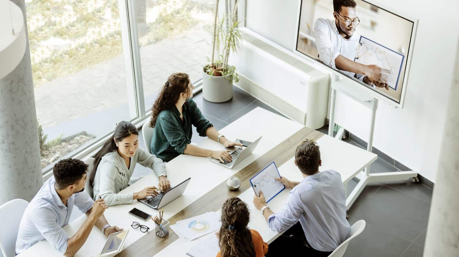 Multiple people having a video conference meeting