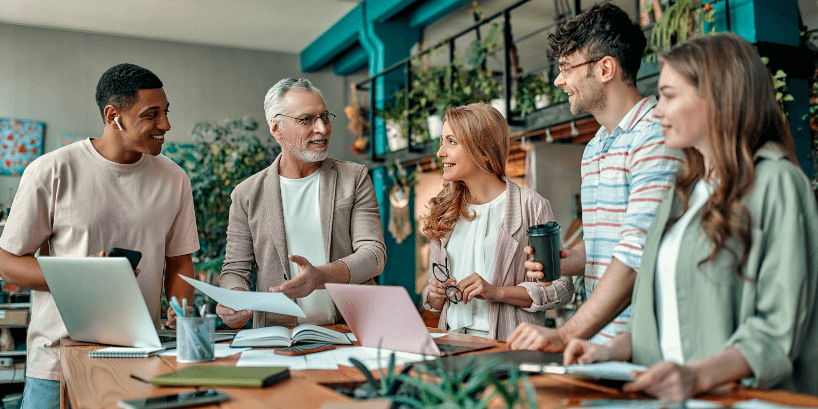 Group of content marketers having a discussion around a table