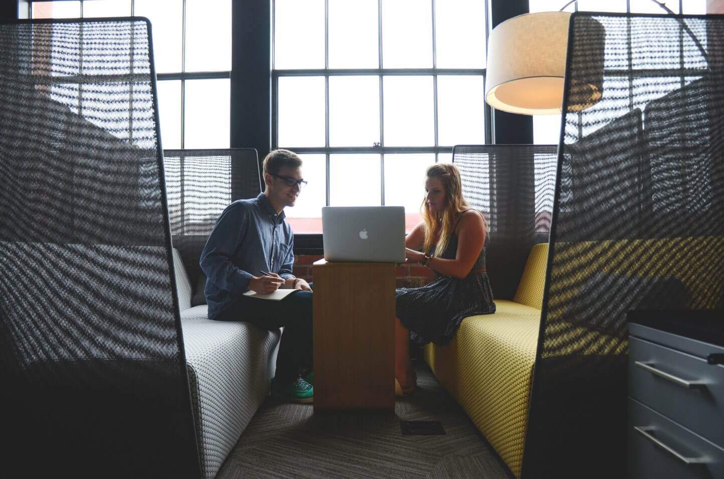 People sitting, working on a laptop