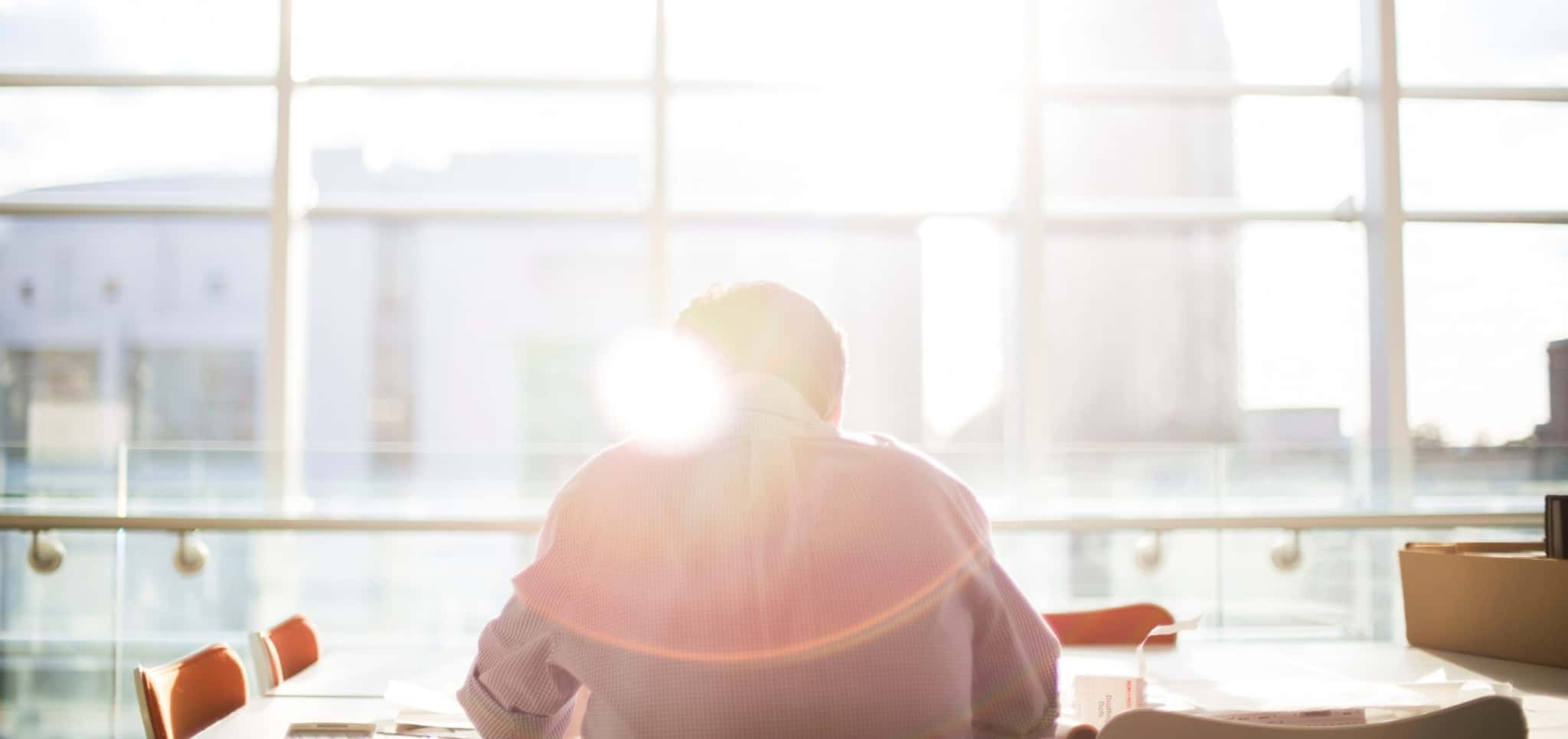 Back of a man in a shirt, daylight