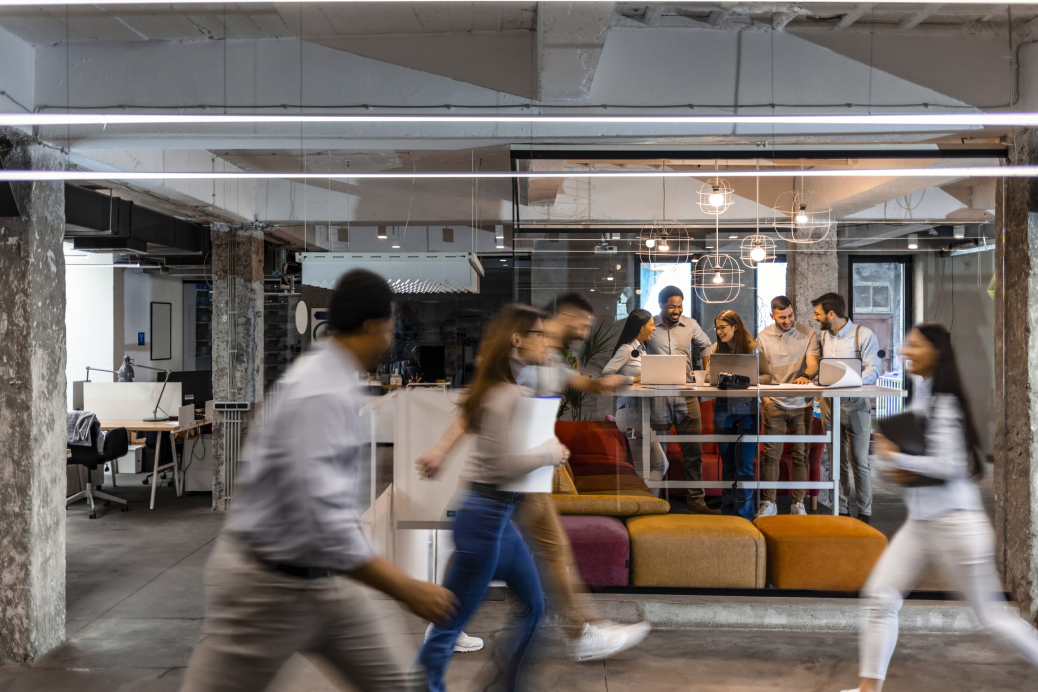 Business people at work in a busy luxury office space