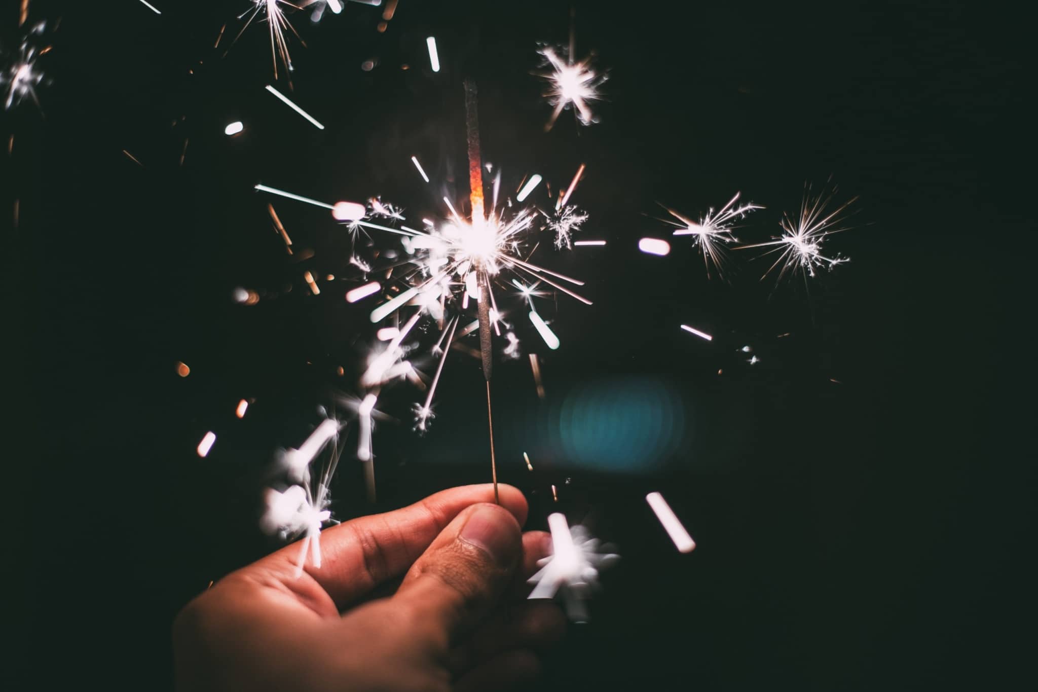 Hand holding a sparkler